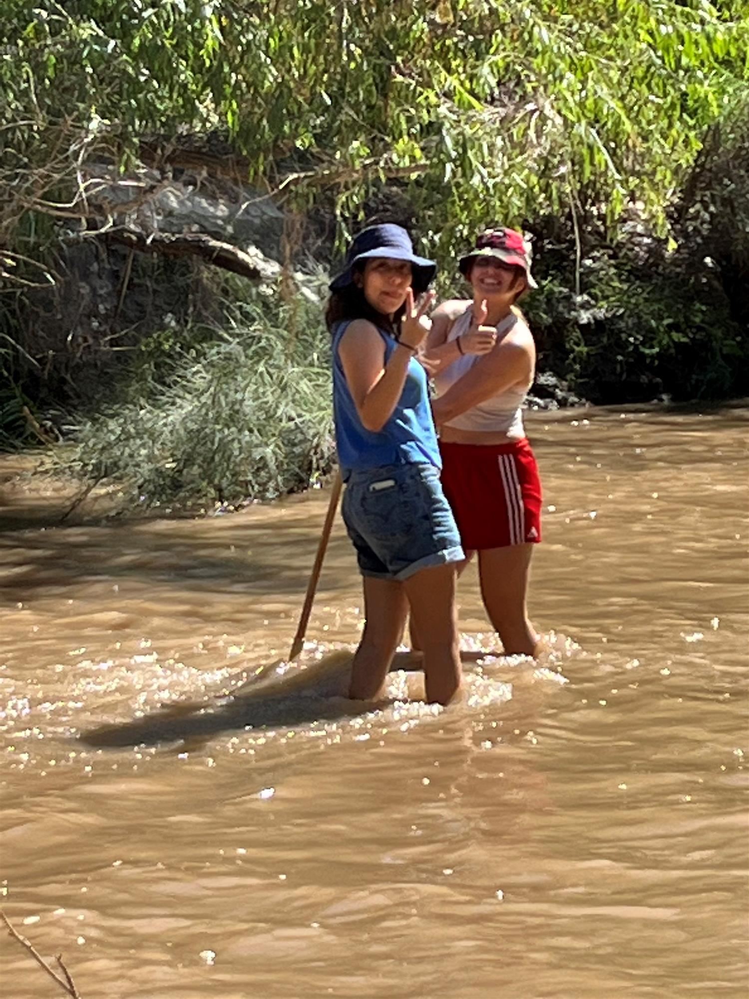 students in the river